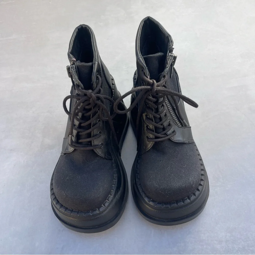 Demonia STOMP-10 Wedge Platform Lace-Up Bootie in Black Canvas